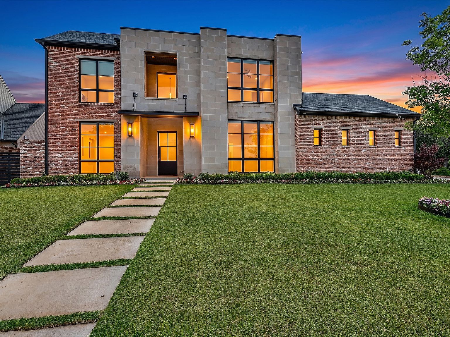The great room at 2500 Park Grove Loop, with imported Mexican tile, a stone fireplace, and open-concept flow to the chef's kitchen.